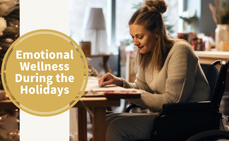 Person in a wheelchair at a table looking at a large tabletop calendar. There's a Christmas tree in the background suggesting they may be planning holiday activities. A yellow circle with white text reads, emotional wellness during the holidays.