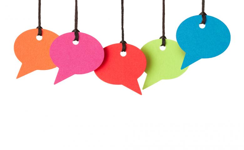 Five blank colourful speech bubbles on a white background