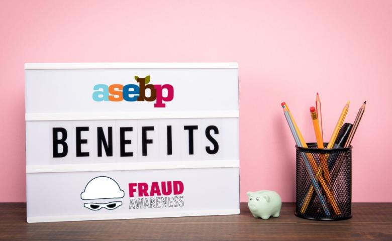 Lightboard sitting on a table with a pink wall behind it. Lightboard reads, ASEBP benefits fraud awareness.