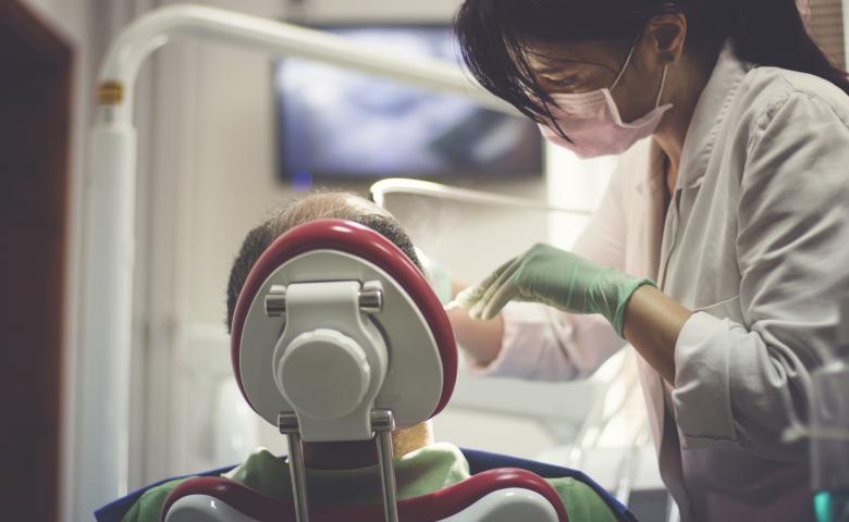 Dentist performing a checkup