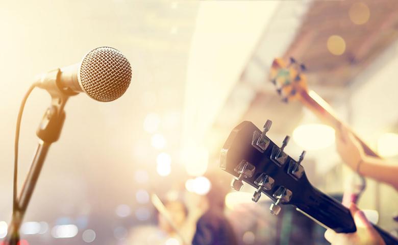 Guitars and microphone on stage from the perspective of the lead singer